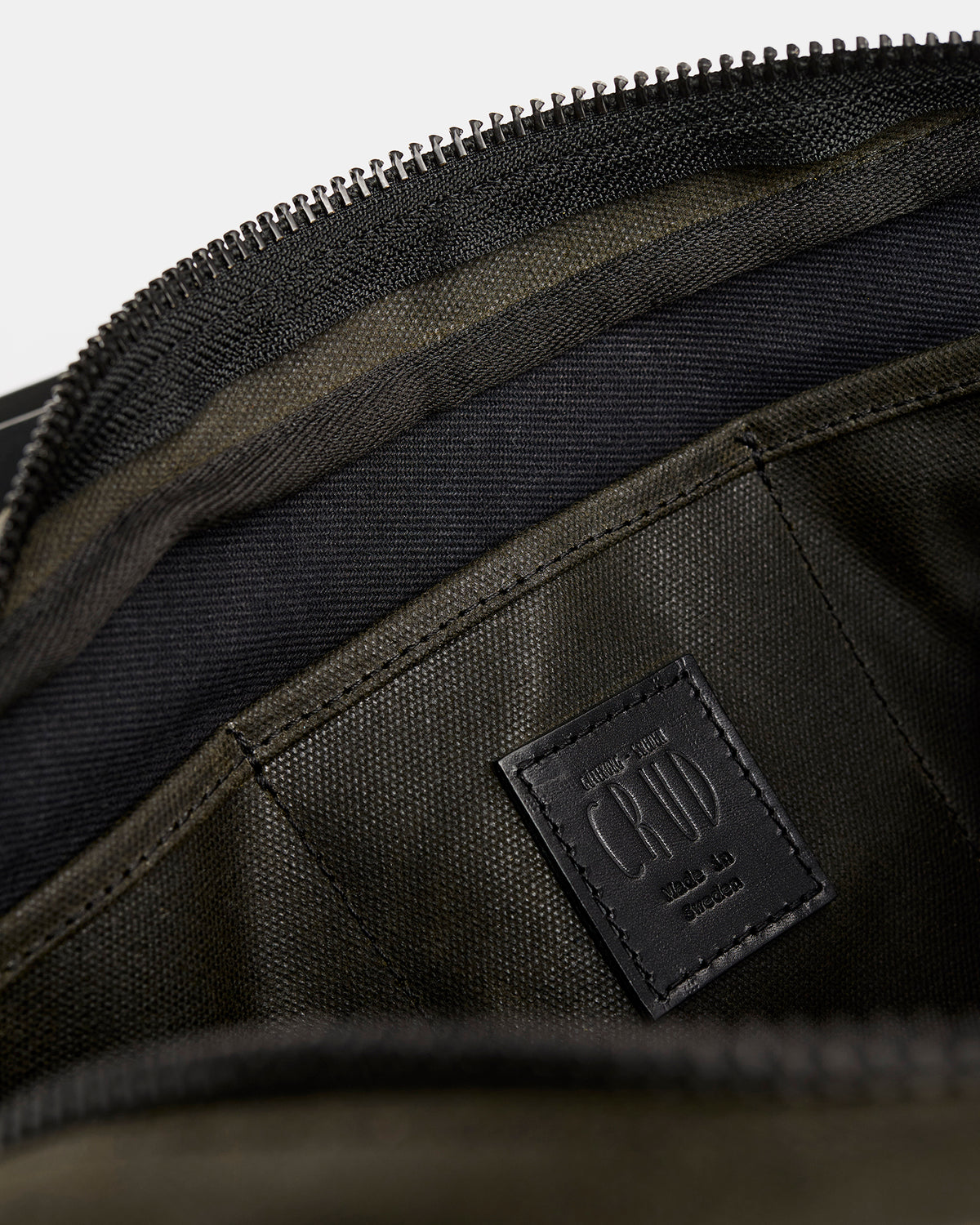 Töfte crossbody bag in black waxed canvas and Tärnsjö leather inside pocket