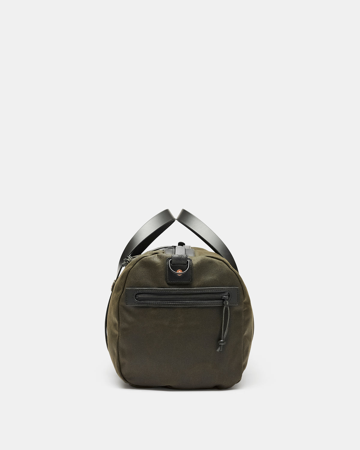 Black waxed canvas duffel bag with heavy leather straps and brass hardware side