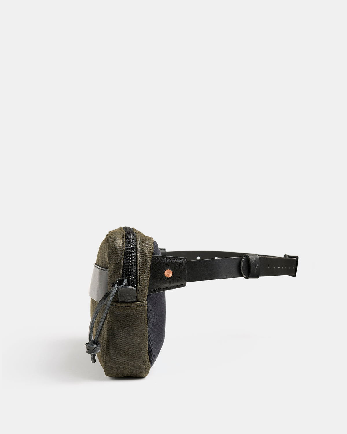 Töfte crossbody bag in black waxed canvas and Tärnsjö leather from side