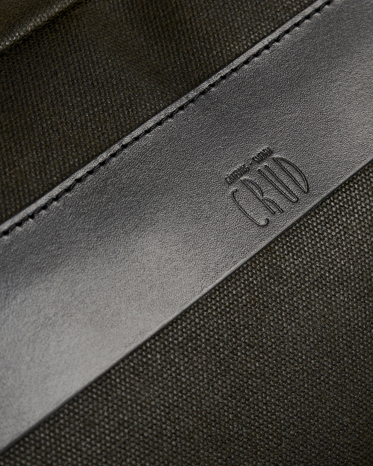 Töfte crossbody bag in black waxed canvas and Tärnsjö leather details