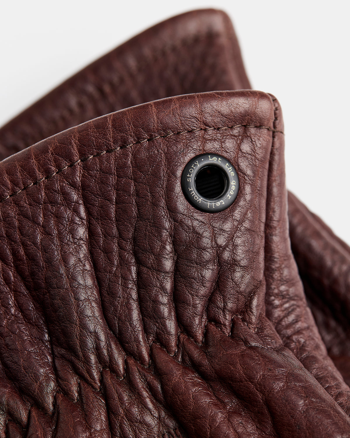 Close-up of black brass eyelets on Gjöra Bison leather gloves