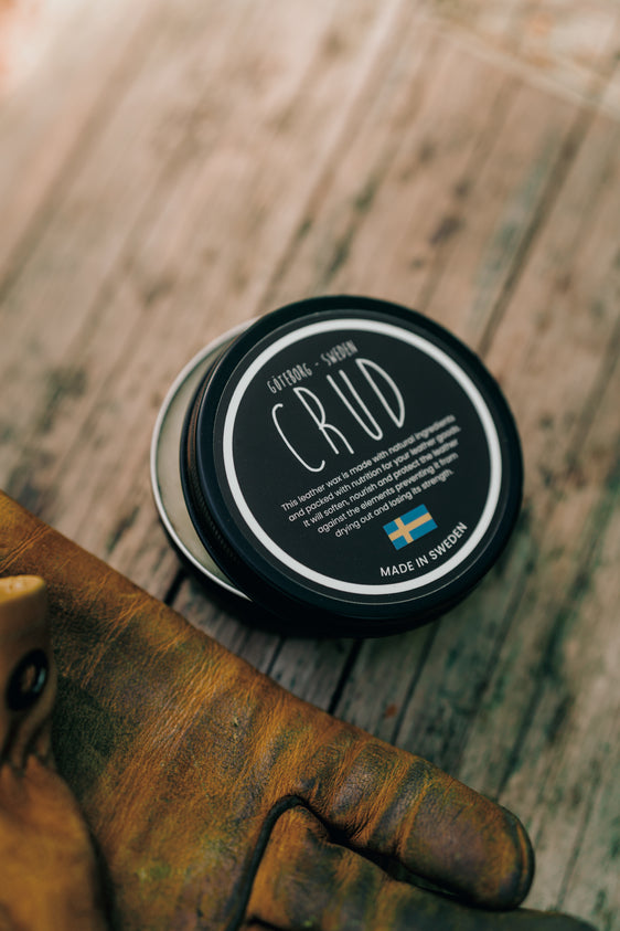 Close-up of Crud leather wax in matte black aluminium container