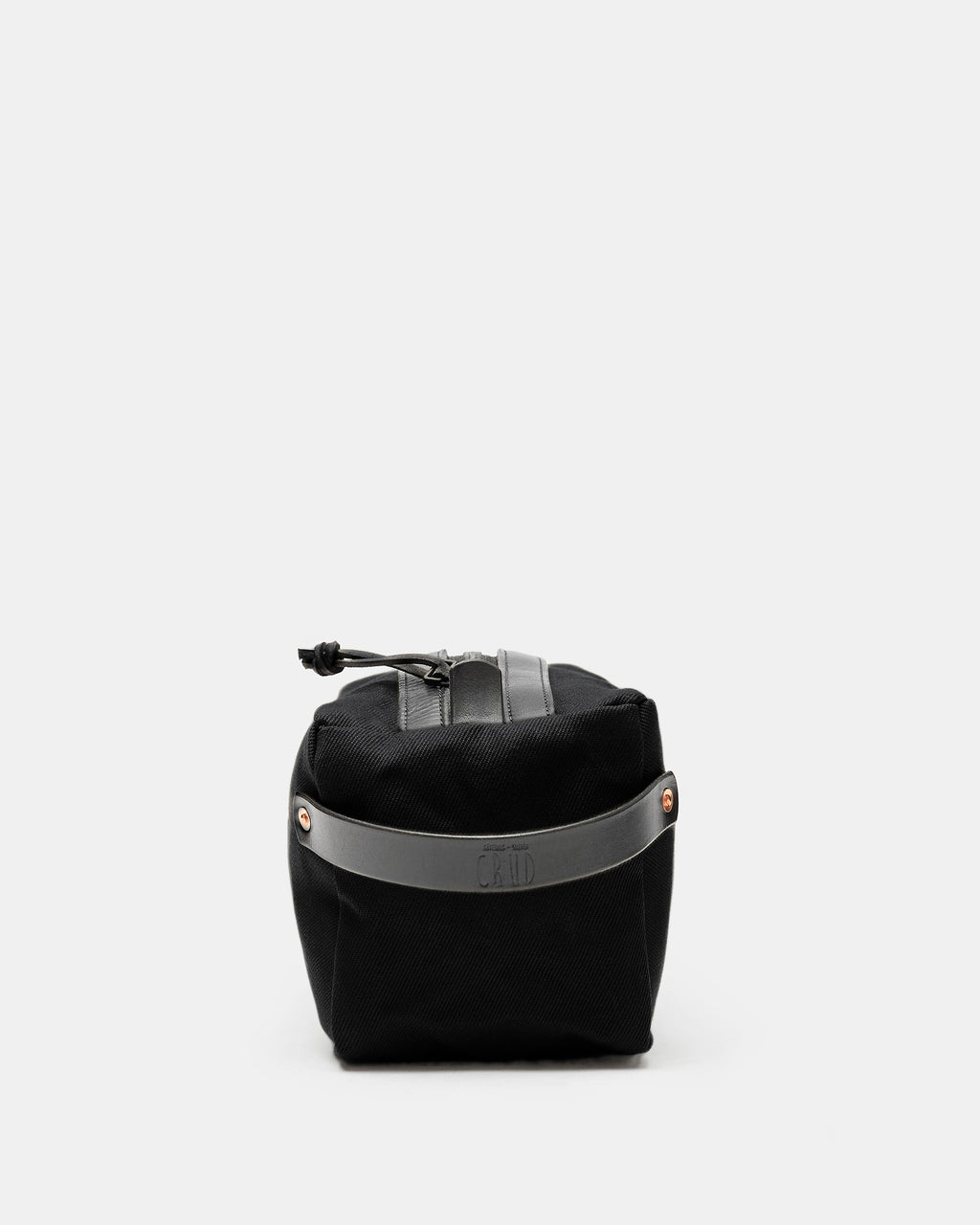 End view of black Crud toiletry bag with embossed black leather strap