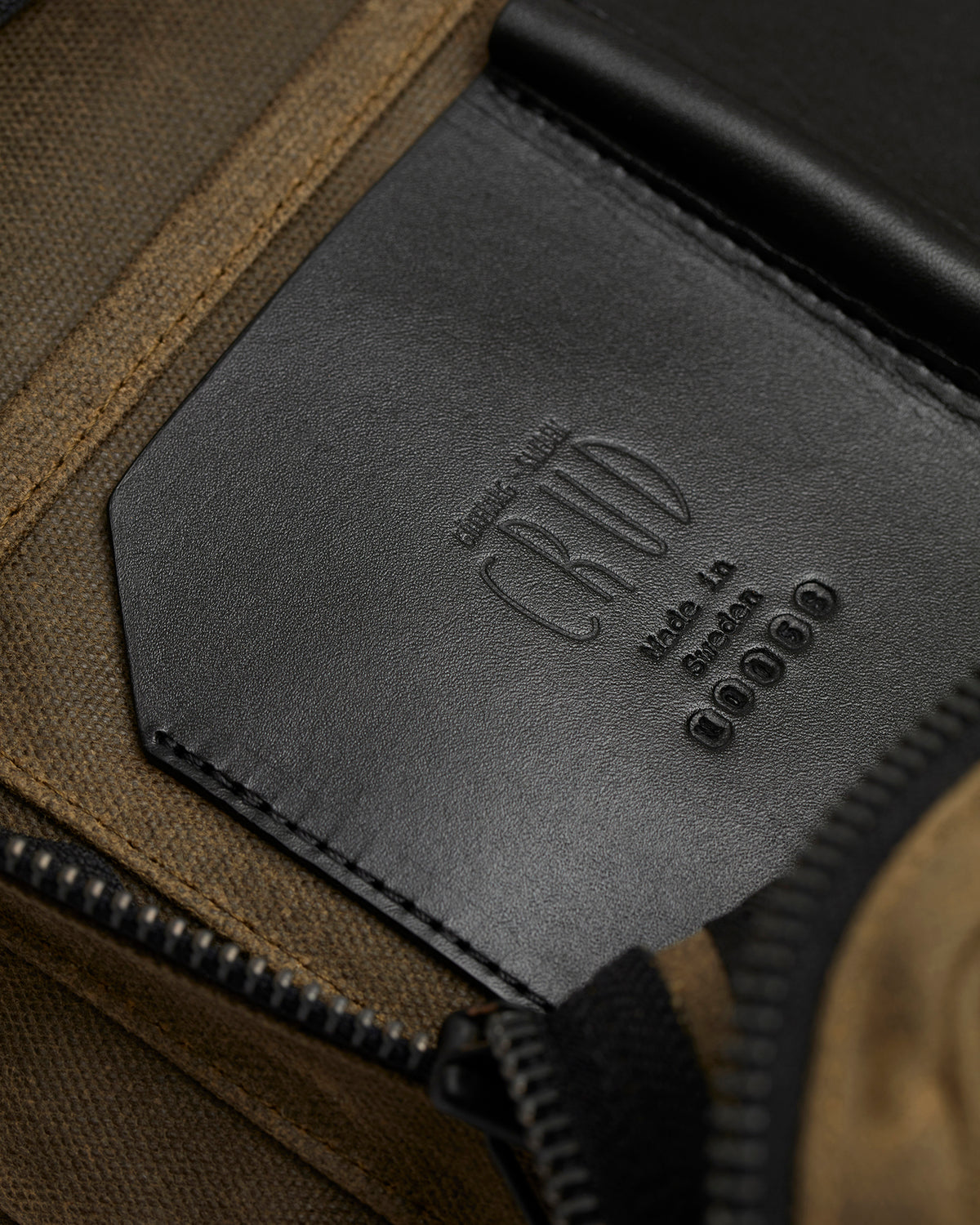 Close-up of serial number on leather pocket on Nova backpack