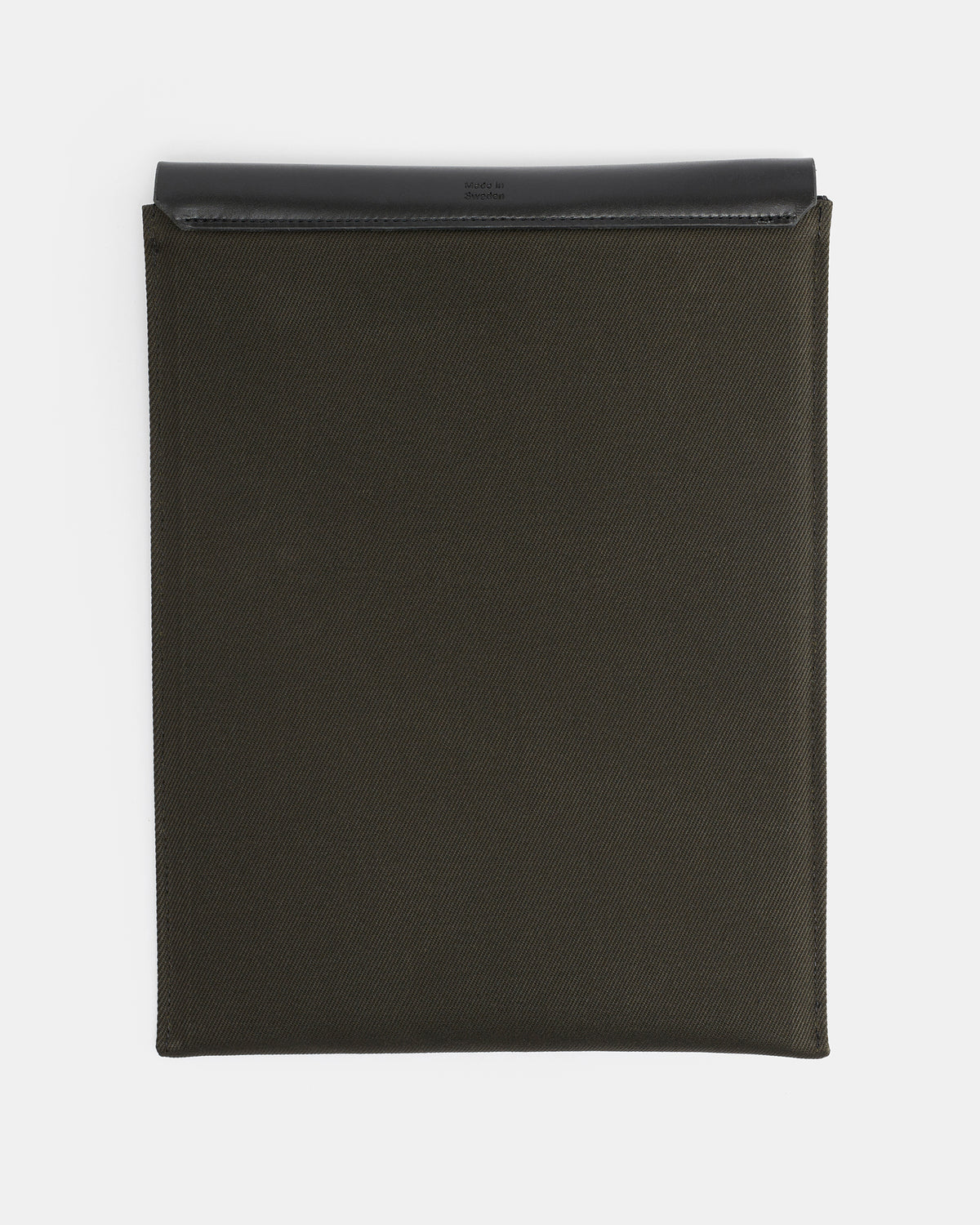 Black waxed canvas laptop sleeve with hand-cut vegetable-tanned leather cover