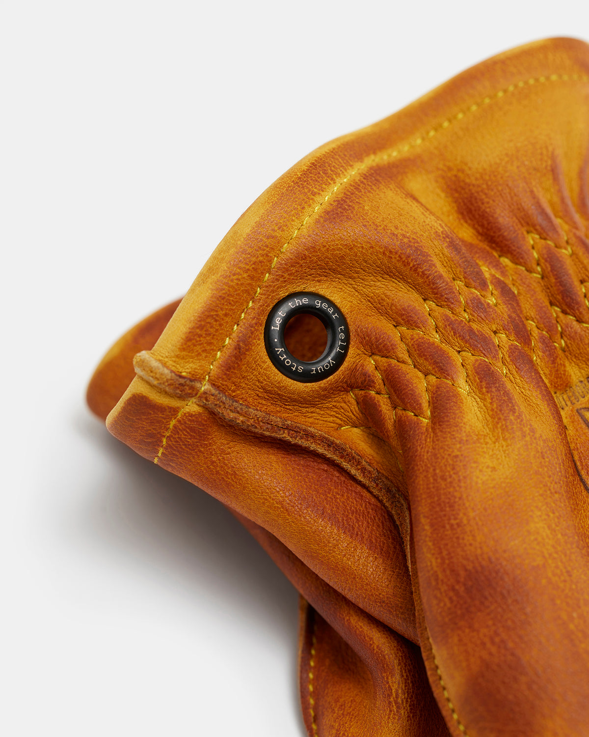 Close-up of black brass eyelet on Molg leather gloves