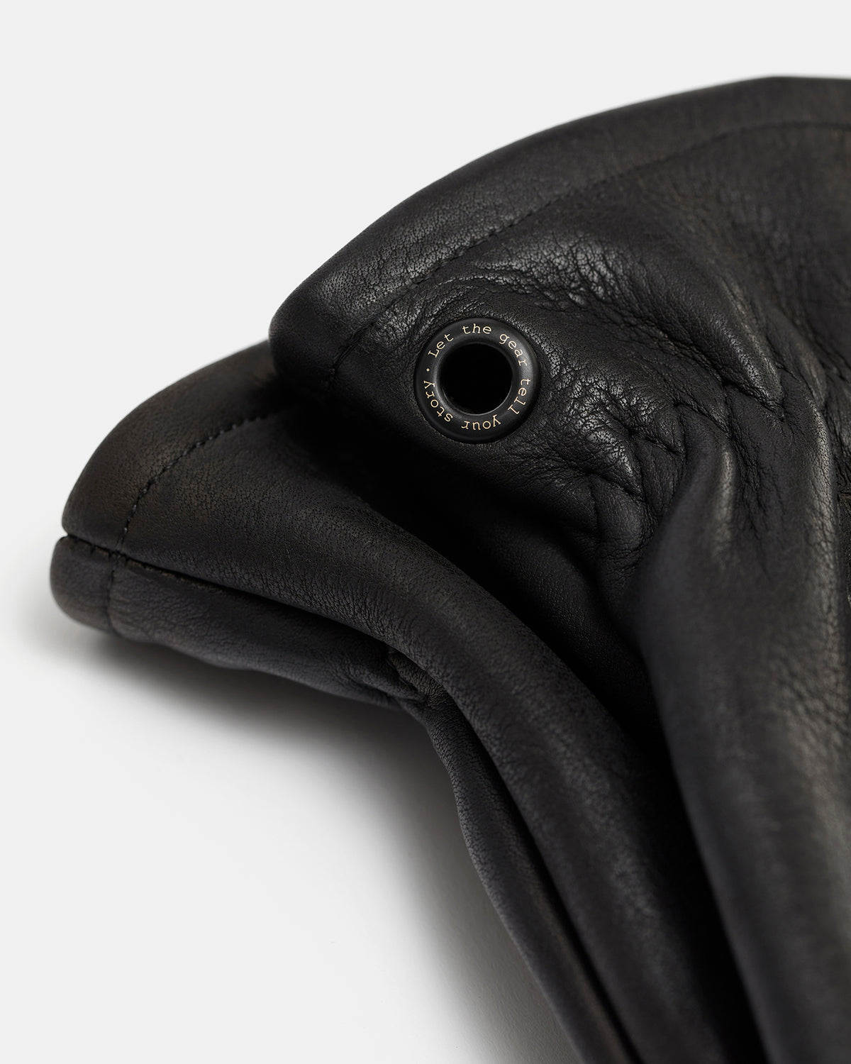 Close-up of black brass eyelet on Gjöra leather gloves