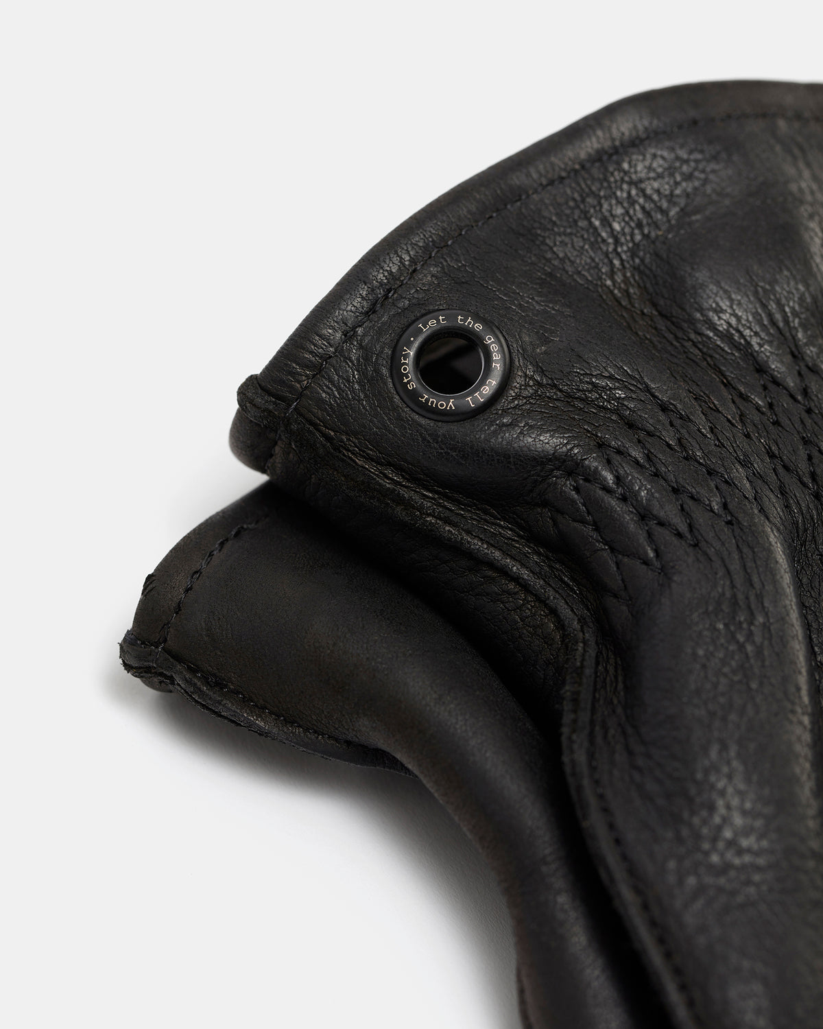 Close-up of black brass eyelet on Molg leather gloves
